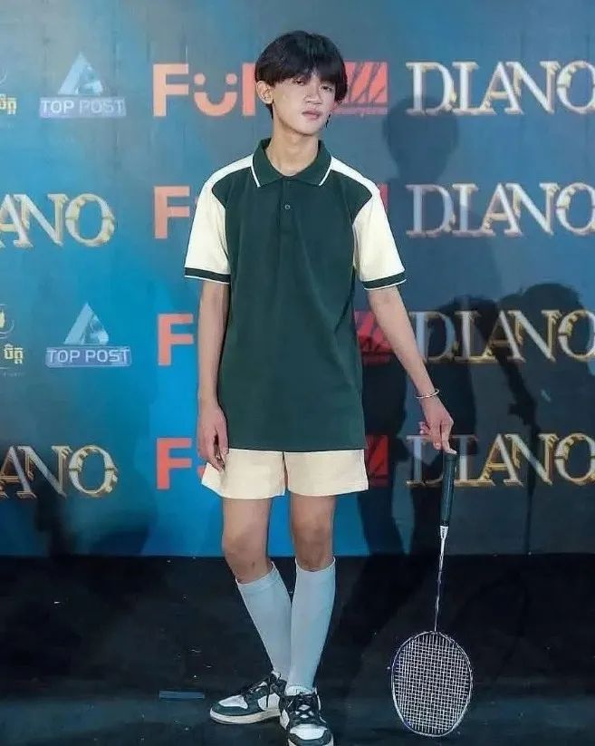 A player posing with a badminton racket